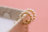pearl huggie hoops {gold}