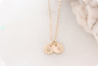 tiny gold disc necklace with initials