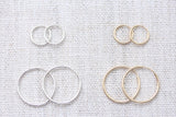 infinity hoop earrings { gold + silver }
