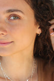 infinity hoop earrings { gold + silver }